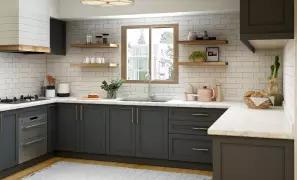Modern kitchen with gray cabinetry and natural light